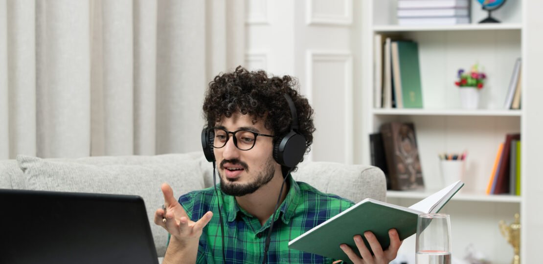 student-online-cute-young-guy-studying-computer-glasses-green-shirt-explaining-class
